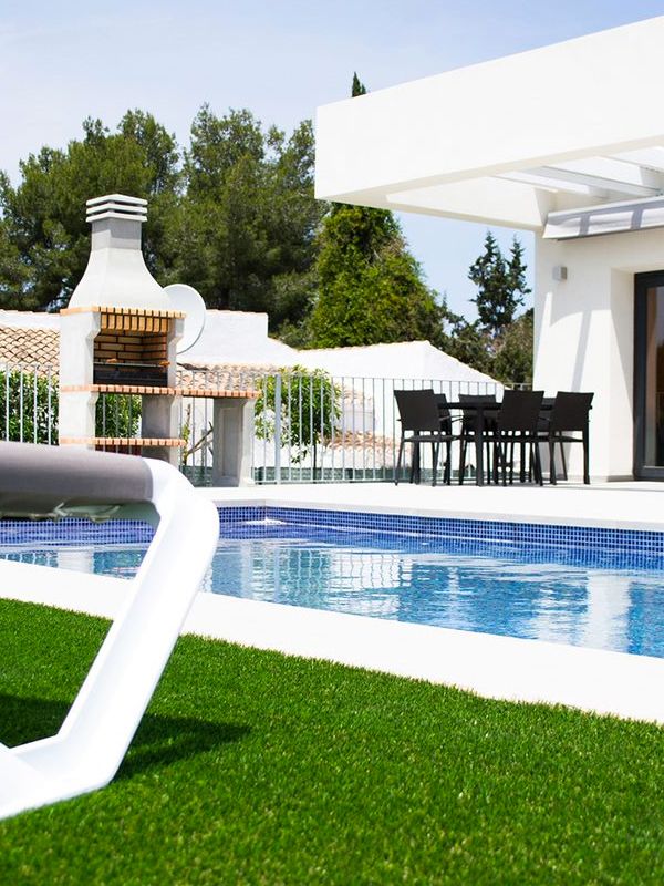 Outdoor pool dining area at Villa Olivo